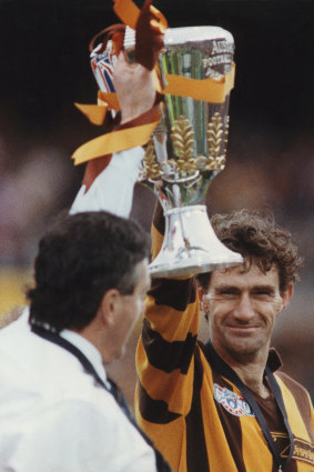 Hawthorn Captain Michael Tuck holding the premiership cup.