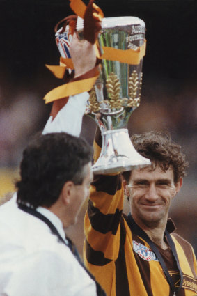 Hawthorn Captain Michael Tuck holding the premiership cup.