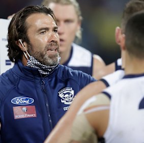 Cats coach Chris Scott addresses his players in the clash with the Bombers.