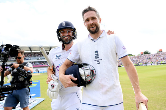 Mark Wood and Chris Woakes leave the field after guiding England to victory.