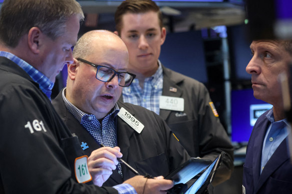 A late flurry helped Wall Street’s Dow index finish in positive territory.