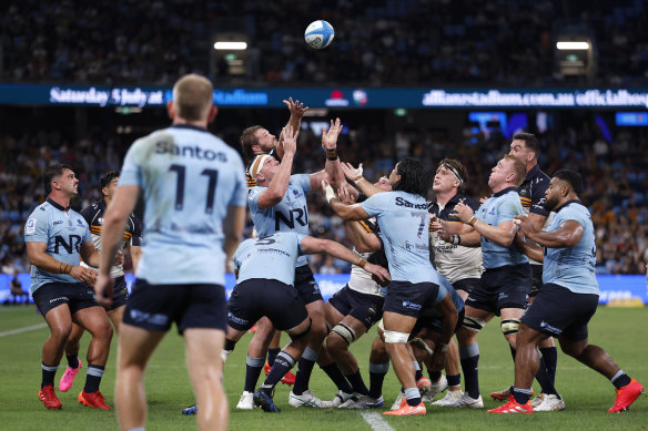 Angus Bell of the Waratahs contests the ball 
