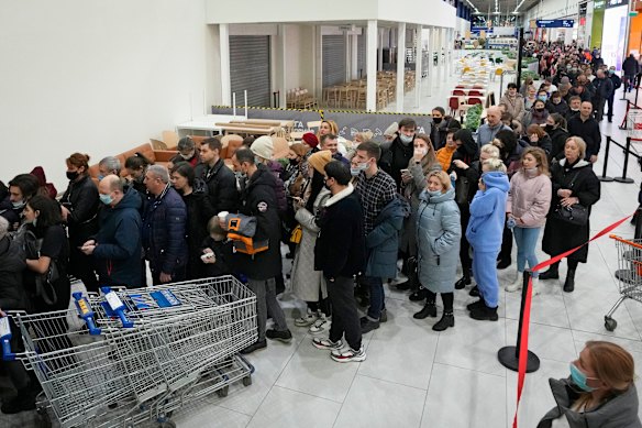 People wait to enter the IKEA store on the outskirts of St Petersburg, Russia, on March 3, 2022 after IKEA announced it would close its stores in Russia and Belarus.