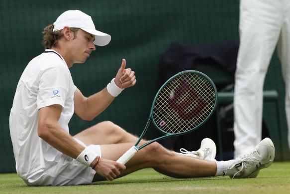 Alex de Minaur gestures after a fall.