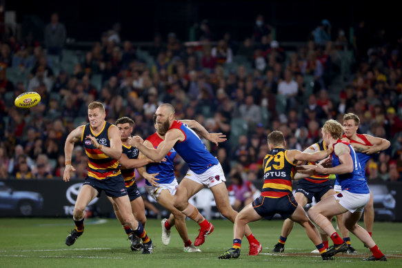 Reilly O’Brien of the Crows competes with Max Gawn.