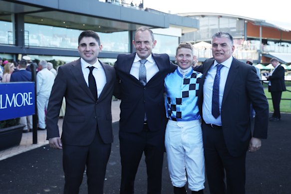 Riccardo Surace jnr and snr, left and right, with trainer Chris Waller and jockey James McDonald after Lazzura’s Coolmore Classic win.