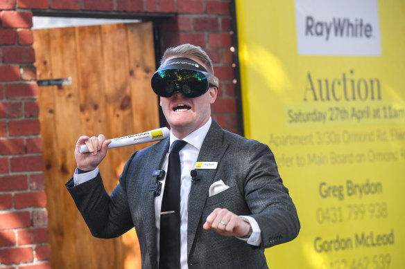 Ray White auctioneer Greg Brydon donned VR goggles to conduct the first virtual live auction.