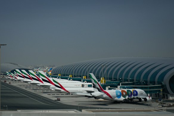 Emirates airplanes are grounded at Dubai International Airport.