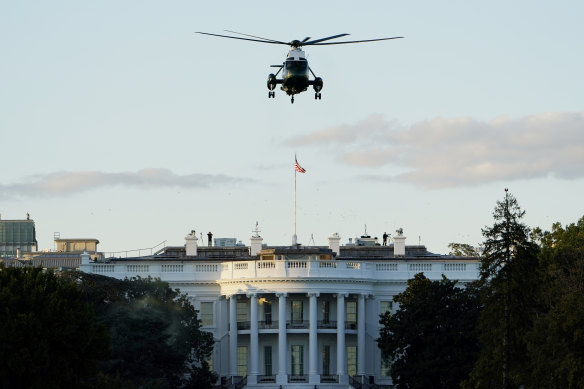 Marine One lifts off from the White House carrying US President Donald Trump to Walter Reed National Military Medical Centre.