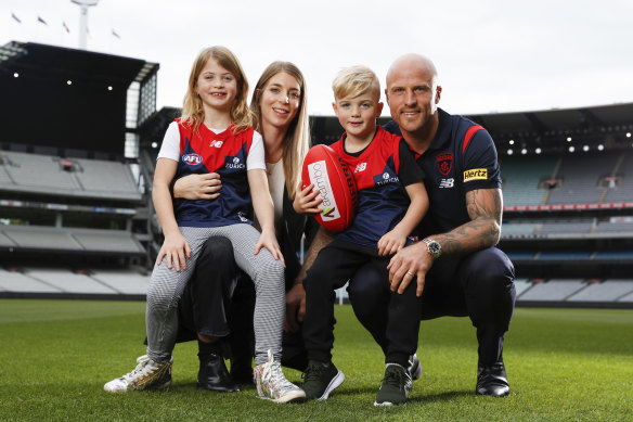Nathan Jones with his wife Jerri and children Bobby and Remi ahead of his 300th game this weekend.