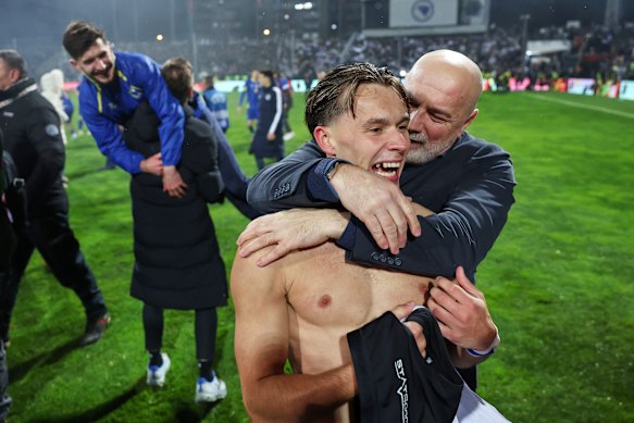 Bosnia’s Amar Dedic celebrates with coach Sergej Barbarez.