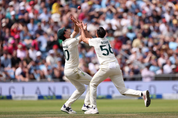 Cummins and Starc clash, but Cummins holds onto catch to dismiss Brook.