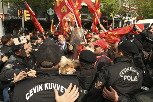 Demonstrators clash with Turkish police officers during a May Day protest in Istanbul, Turkey.