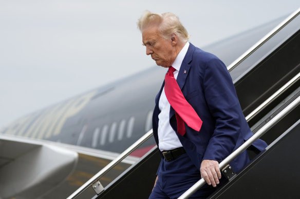 Former president Donald Trump arrives at Ronald Reagan Washington National Airport.