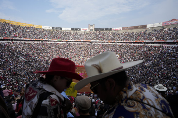 Spectators watch a bullfight at the Plaza Mexico, the largest bullfighting arena in the world.