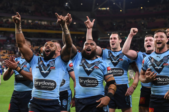 A jubilant NSW side celebrate at Suncorp Stadium.