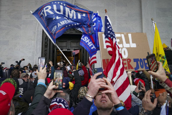 The violent crowd supporting  Donald Trump riot outside the Capitol in Washington.