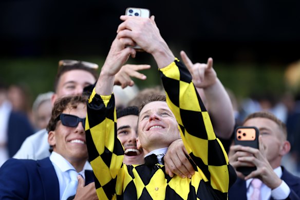 Autumn Glow jockey James McDonald celebrates with punters after her Golden Eagle win last November.