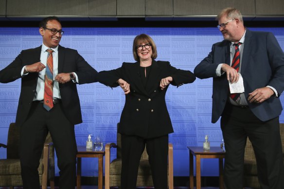 Associate Professor Sanjaya Senanayake, infectious diseases specialist with the ANU, Professor Mary-Louise McLaws, epidemiologist with UNSW, and Professor Robert Booy, Professor of Paediatrics and Child Health at the University of Sydney, during an address in 2021.