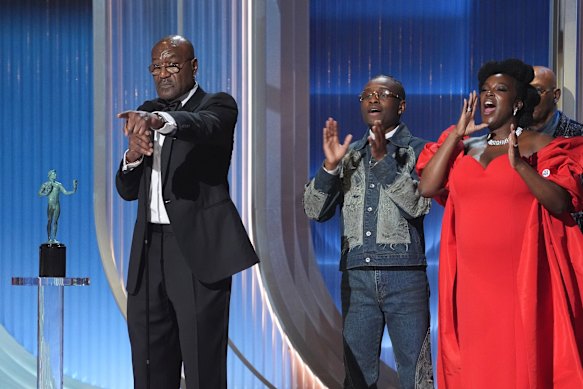 Delroy Lindo (left), Miles Caton and Wunmi Mosaku (right) accept the award for outstanding performance by a cast in a motion picture for Sinners at the Actor Awards.