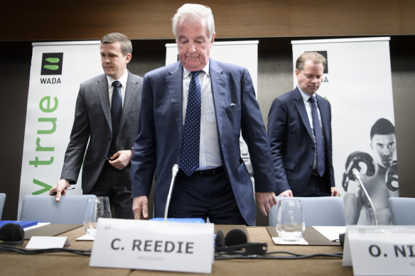WADA president-elect Witold Banka (left), president Craig Reedie and director-general Olivier Niggli arrive for the press conference to announce the Russia sanctions.