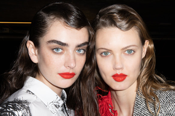 Model Alisha Nesvat and Lindsey Wixson are seen backstage at the MSGM fashion show on February 22, 2020 in Milan, Italy. 