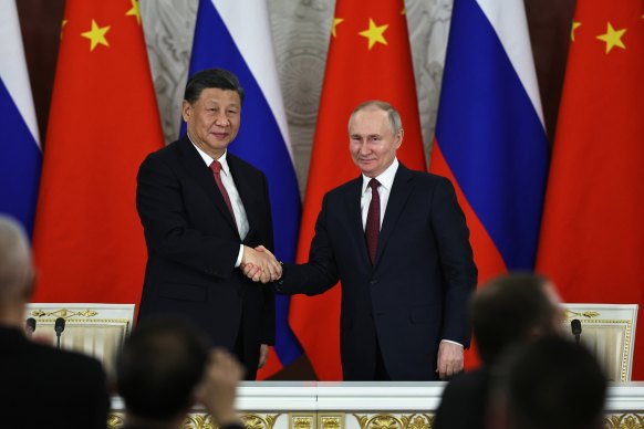 Russian President Vladimir Putin (right) and Chinese President Xi Jinping at the Grand Kremlin Palace in Moscow on Tuesday. 