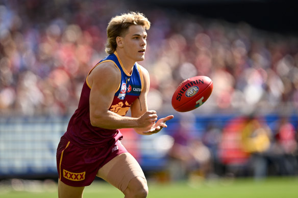 Will Ashcroft handballs during the grand final. He was later named Norm Smith medallist.