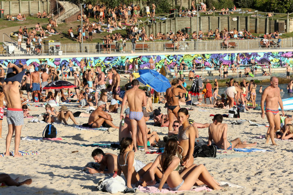 Beachgoers are seen at Bondi Beach on Friday despite the threat of novel coronavirus in Sydney.