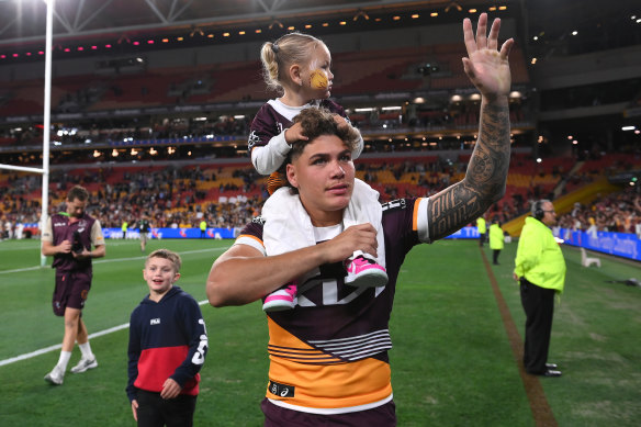 Reece Walsh celebrates Saturday night’s preliminary final win with daughter Leila.