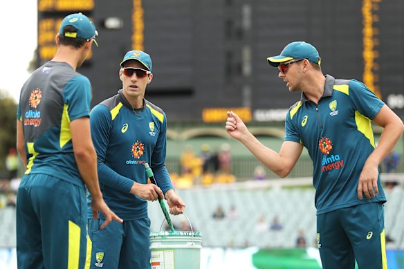 Josh Hazlewood (right) with fellow quicks Mitchell Starc and Pat Cummins.