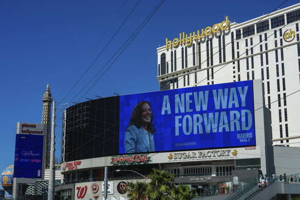 A billboard displays an advertisement for the Harris campaign on the Las Vegas Strip.