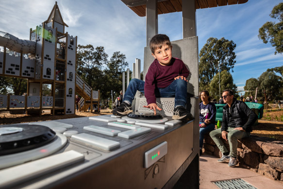 Alexander, 4, plays on the DJ booth at the new Thomas Street playground in Hampton.
