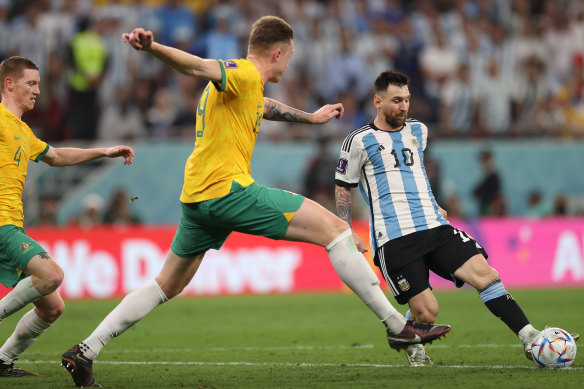 Harry Souttar defends against Lionel Messi.