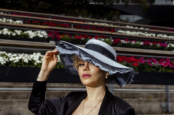 Sydney designer Lillian Khallouf wears The Everest-inspired blue boater hat, custom-made by Nerida Winter at Royal Randwick Racecourse.