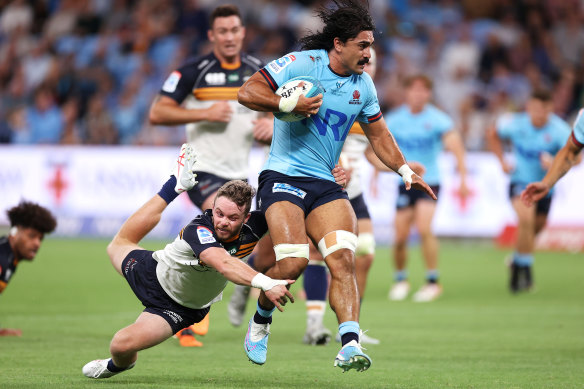 Charlie Gamble is tackled in the Waratahs’ Super Rugby opener against the Brumbies.