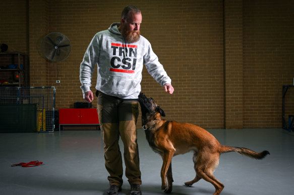 Brad Griggs, Boronia-based canine behaviour specialist, with his dog Dammit.