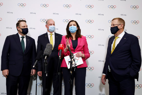 Lord Mayor Adrian Schrinner and then federal Sports Minister Richard Colbeck with Premier Annastacia Palaszczuk and then AOC president John Coates after Brisbane was named host of the 2032 Olympics in July last year.