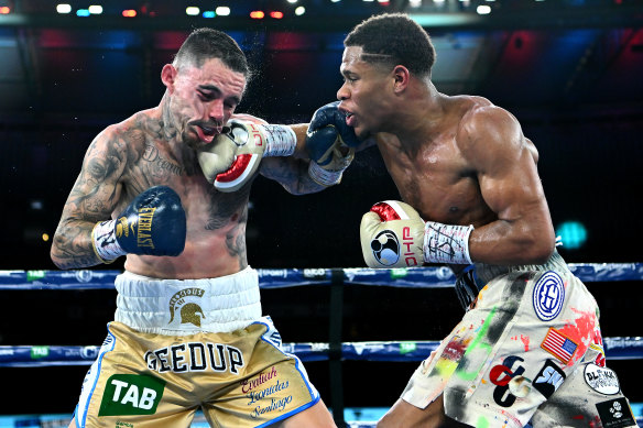 George Kambosos cops some punishment from Devin Haney during their title fight at Marvel Stadium in June.