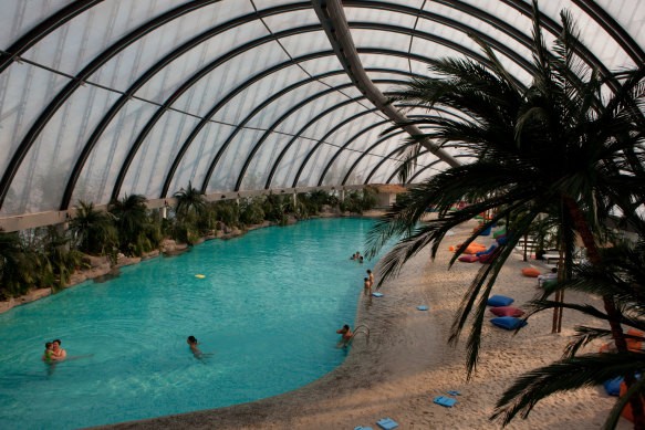 Khan Shatyr’s Sky Beach Club includes an indoor lagoon and glass atrium.