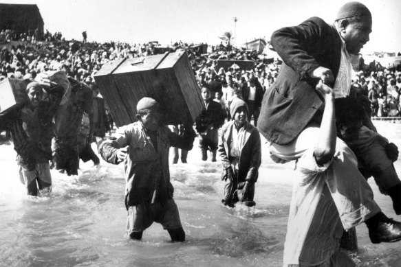 Palestinians driven from their homes by Israeli forces and fleeing via the sea at Acre, 1948.