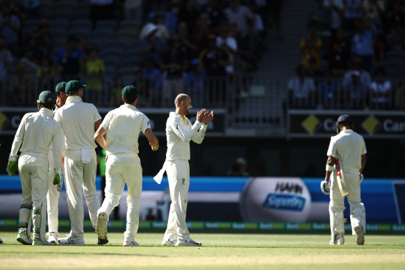 Nathan Lyon (second right) has dismissed Kohli seven times in Tests.
