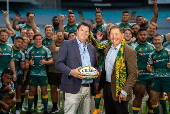 Hamish McLennan with World Cup bid boss Phil Kearns and the Wallabies in 2020 after securing the 2027 hosting rights.