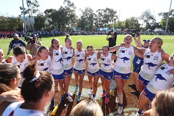 The dominant Roos belt out their famous club song at their Arden Street home.