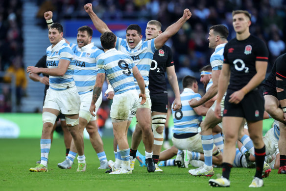 Ignacio Ruiz celebrates Argentina’s win over England with teammates.