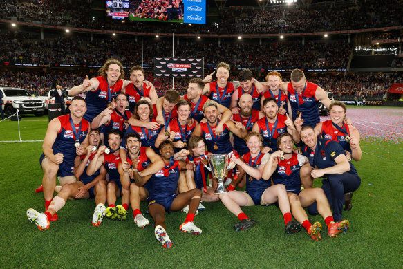 The Demons celebrate their grand final victory against the Bulldogs. 