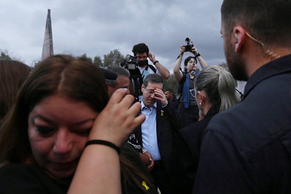 Israeli President Isaac Herzog among the families of those killed at the site of the Nova music festival on October 7, 2023.