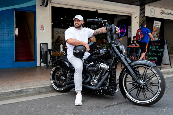 Easy rider: Cronulla prop Royce Hunt on his Harley this week
