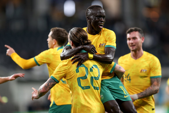 The Socceroos celebrate Jackson Irvine’s goal.