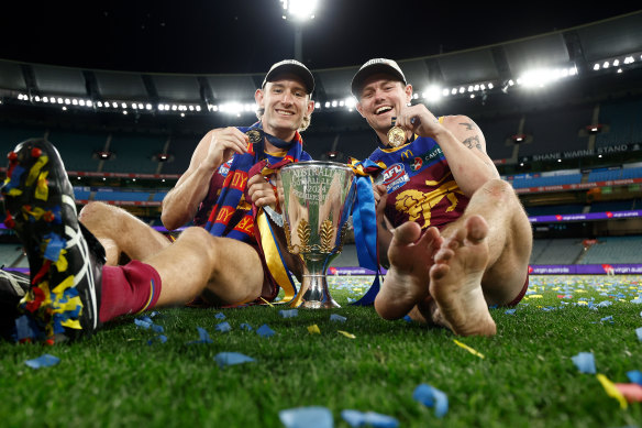 Harris Andrews (left) and Lachie Neale with last year’s premiership cup.